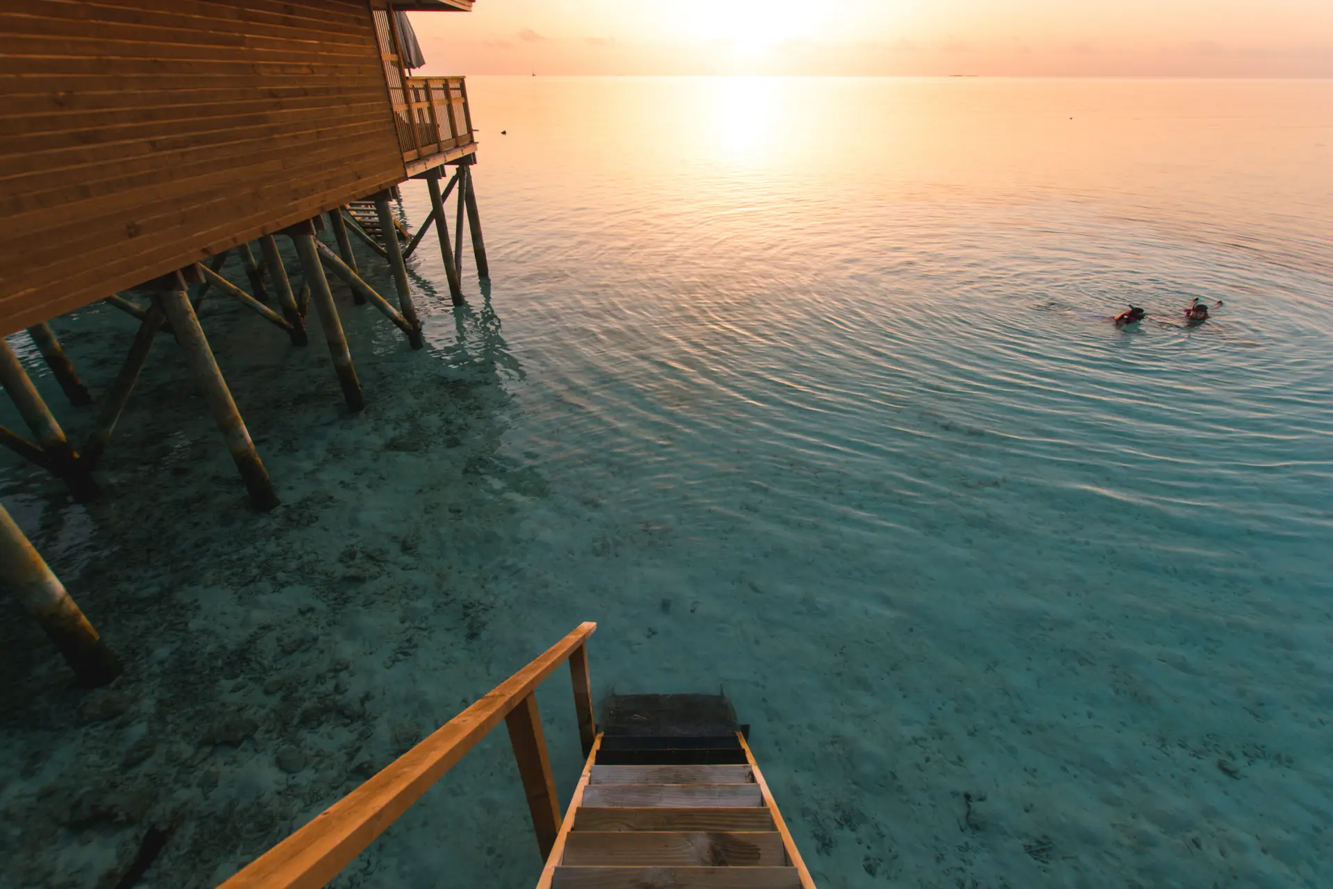 Beautiful tropical Maldives resort hotel and island with beach and sea on sky sunset for holiday vacation background concept - Boost up color Processing.